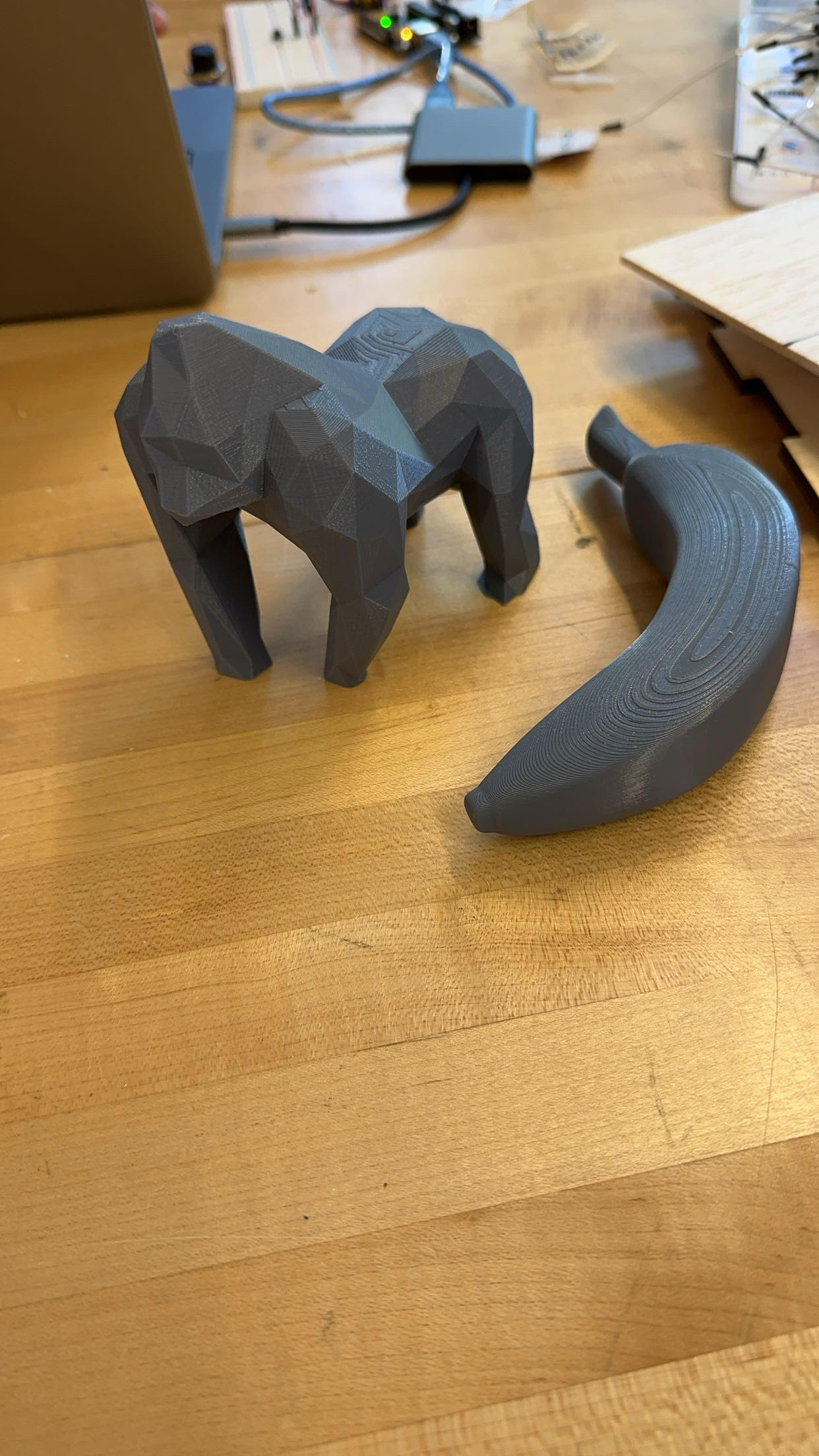 3D printed low-poly gorilla figure and banana prop for the exhibit